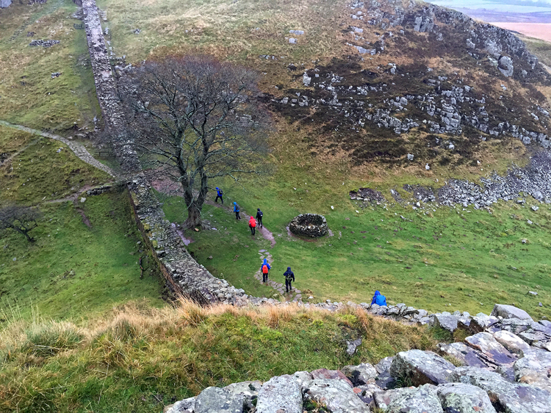 Walking along the Wall at Sycamore Gap