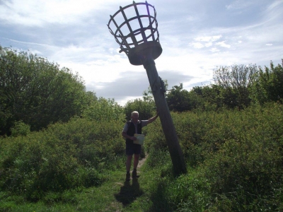 Norman holds the beacon up